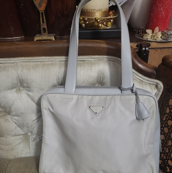 Prada Handbags - Authentic Prada nylon bag with lock and key including key clochet.